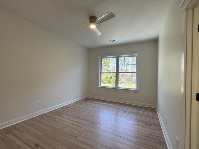 empty room featuring light hardwood / wood-style flooring and ceiling fan