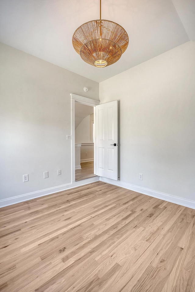 spare room featuring light wood-type flooring