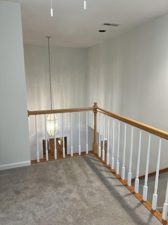 interior space with carpet floors and visible vents