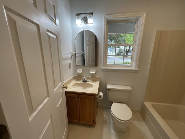 full bath featuring a tub to relax in, a shower, toilet, vanity, and baseboards