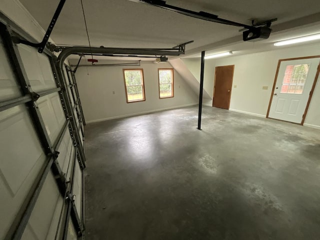 garage featuring baseboards and a garage door opener