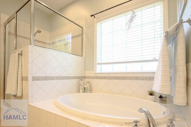 4800 Bay Branch Church Rd, Claxton, GA 30417 - full bathroom featuring a garden tub and a stall shower