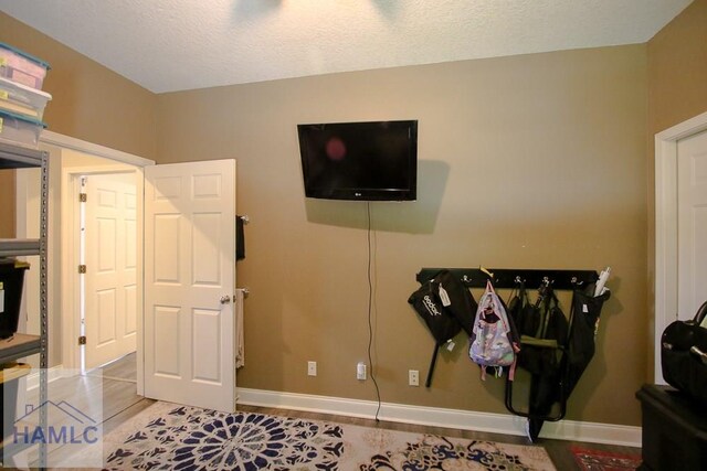 4800 Bay Branch Church Rd, Claxton, GA 30417 - office area featuring baseboards, light tile patterned floors, and a textured ceiling