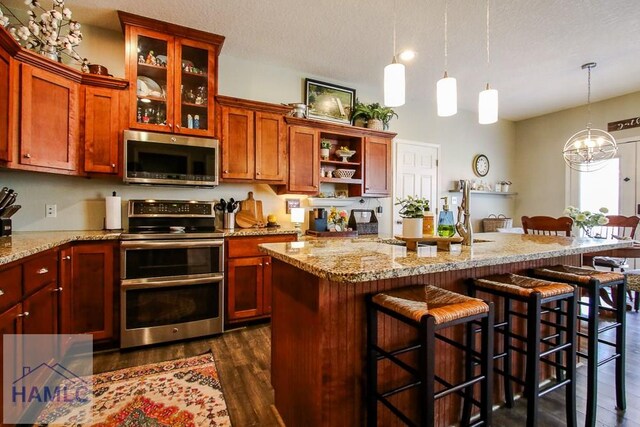 4800 Bay Branch Church Rd, Claxton, GA 30417 - kitchen with appliances with stainless steel finishes, dark wood-style floors, a chandelier, a kitchen bar, and a textured ceiling