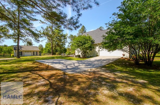 4800 Bay Branch Church Rd, Claxton, GA 30417 - view of front of house featuring concrete driveway, an attached garage, and a shingled roof