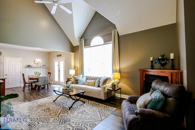 4800 Bay Branch Church Rd, Claxton, GA 30417 - living area with a ceiling fan, high vaulted ceiling, wood finished floors, a fireplace, and baseboards