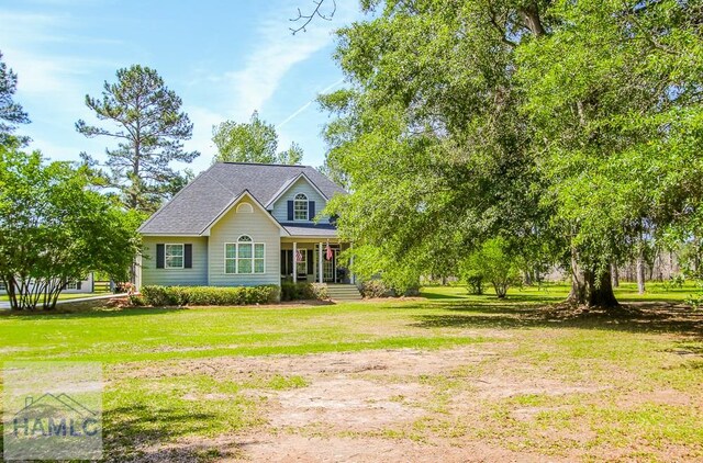 4800 Bay Branch Church Rd, Claxton, GA 30417 - view of front of property with covered porch and a front yard
