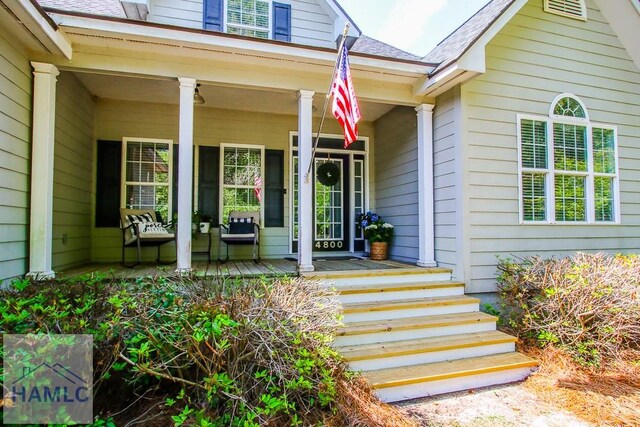 4800 Bay Branch Church Rd, Claxton, GA 30417 - doorway to property featuring covered porch and roof with shingles