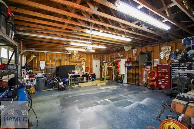 4800 Bay Branch Church Rd, Claxton, GA 30417 - garage with a garage door opener and a workshop area