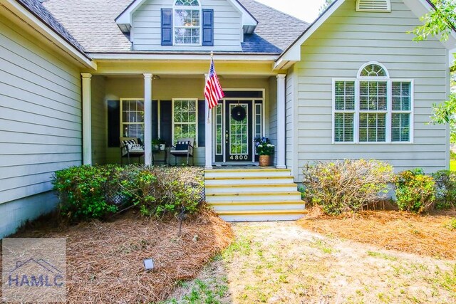 4800 Bay Branch Church Rd, Claxton, GA 30417 - doorway to property with a porch and a shingled roof