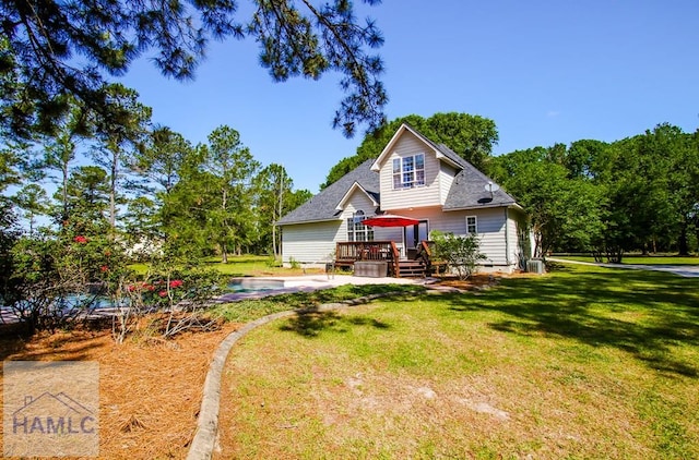 4800 Bay Branch Church Rd, Claxton, GA 30417 - back of property with a deck, a swimming pool, a lawn, and roof with shingles