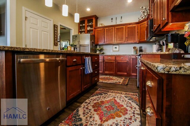 4800 Bay Branch Church Rd, Claxton, GA 30417 - kitchen with appliances with stainless steel finishes, dark wood finished floors, dark stone counters, recessed lighting, and pendant lighting