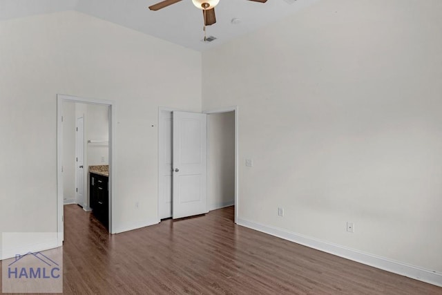 333 Grayson Ave, Hinesville, GA 31313 - unfurnished bedroom with wood finished floors, high vaulted ceiling, baseboards, ceiling fan, and connected bathroom