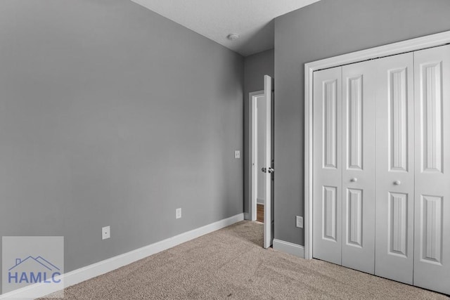 333 Grayson Ave, Hinesville, GA 31313 - unfurnished bedroom with carpet, a closet, and baseboards