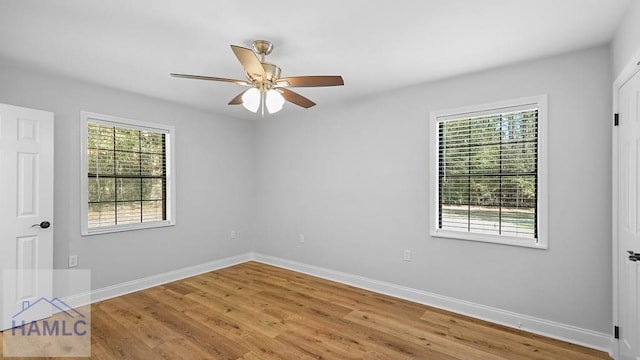 empty room featuring wood-type flooring and ceiling fan