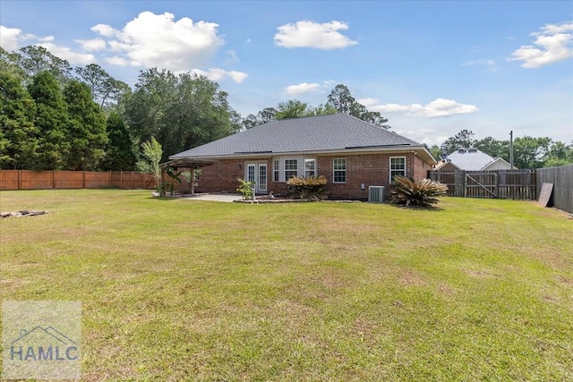 102 Penny Ln, Guyton, GA 31312 - back of house featuring a patio, central AC, and brick siding