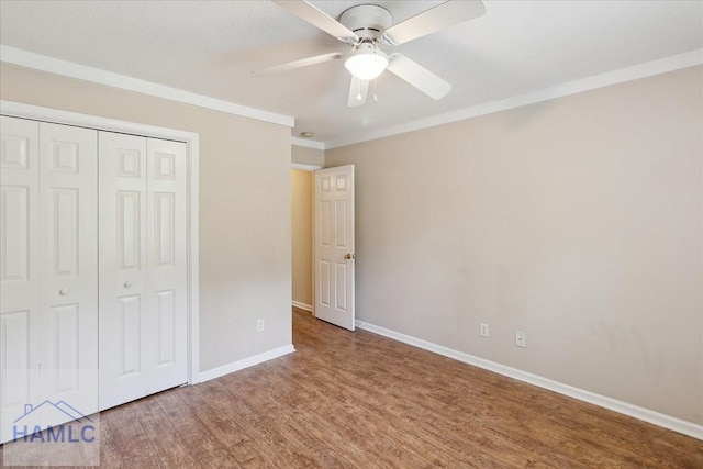 102 Penny Ln, Guyton, GA 31312 - unfurnished bedroom with wood finished floors, a closet, baseboards, a ceiling fan, and ornamental molding