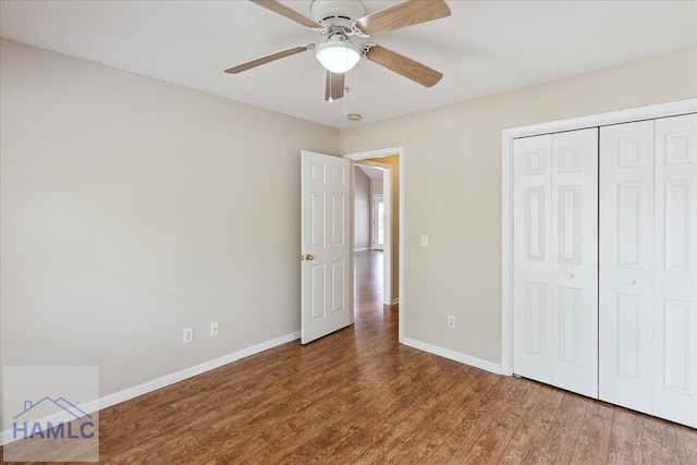102 Penny Ln, Guyton, GA 31312 - unfurnished bedroom featuring baseboards, wood finished floors, a closet, and ceiling fan