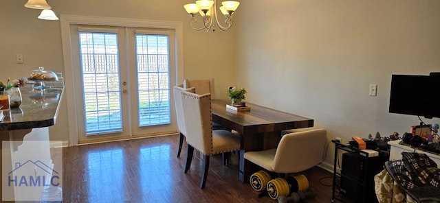 dining room featuring an inviting chandelier, dark wood-type flooring, and french doors