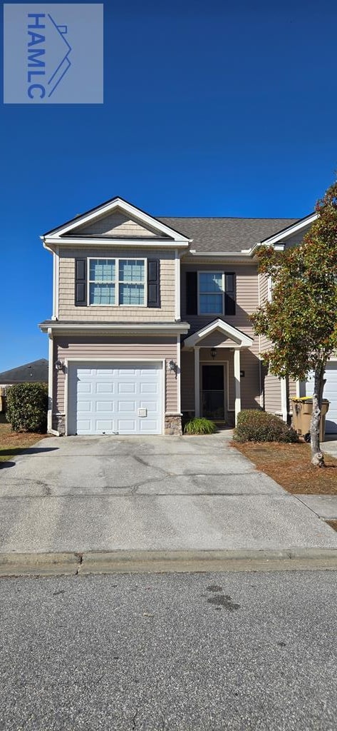 front of property with a garage