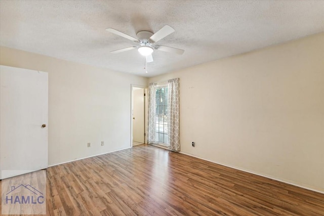 spare room featuring ceiling fan, light hardwood / wood-style flooring, and a textured ceiling