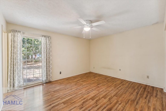 unfurnished room featuring a textured ceiling, hardwood / wood-style flooring, and ceiling fan