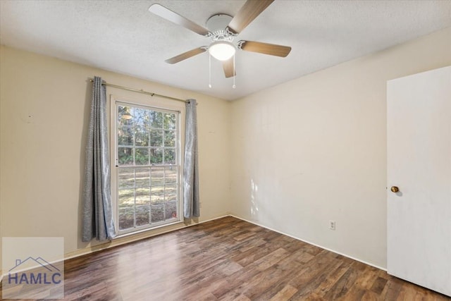 spare room with hardwood / wood-style floors, a textured ceiling, and ceiling fan