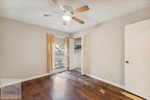 unfurnished bedroom featuring dark hardwood / wood-style flooring, a closet, and ceiling fan