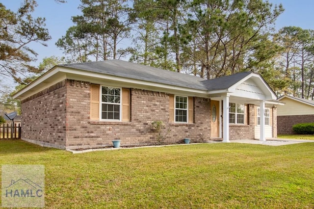 130 Melrose Pl, Rincon, GA 31326 - ranch-style house featuring brick siding and a front yard