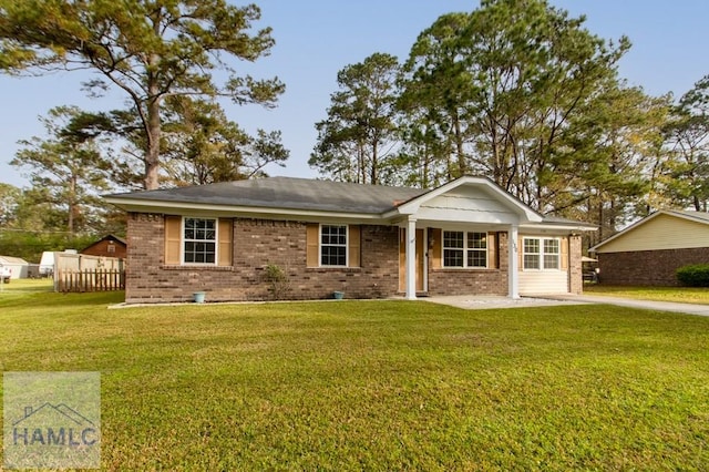 130 Melrose Pl, Rincon, GA 31326 - view of front of house with a front lawn, fence, and brick siding