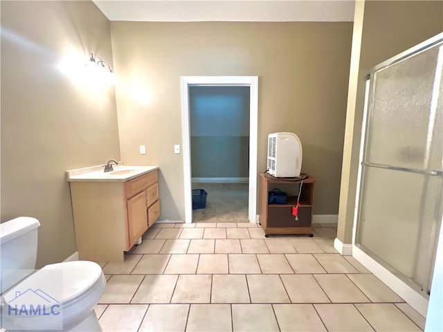 bathroom with vanity, an enclosed shower, tile patterned floors, and toilet