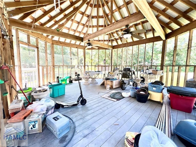 sunroom featuring vaulted ceiling and ceiling fan