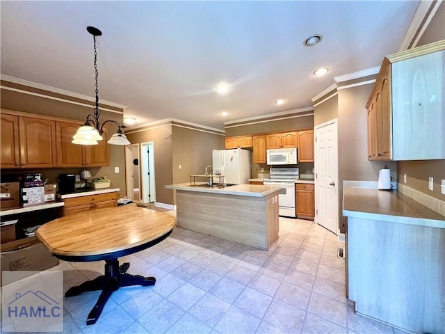 kitchen with sink, ornamental molding, pendant lighting, white appliances, and a kitchen island with sink