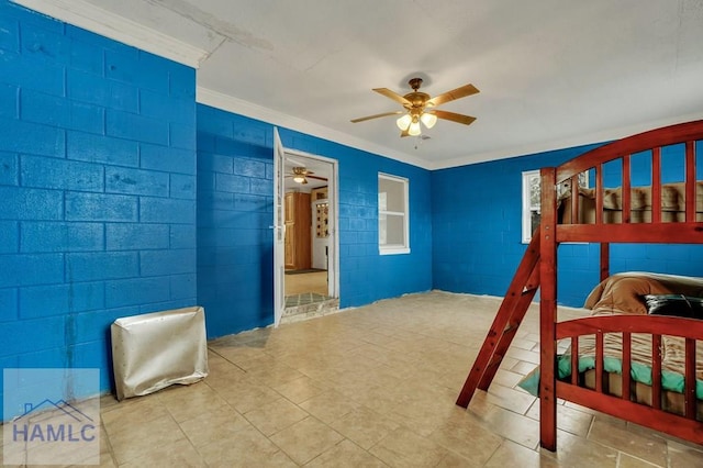 bedroom featuring ceiling fan and ornamental molding