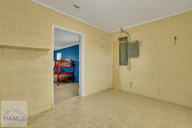 unfurnished room featuring electric panel and crown molding