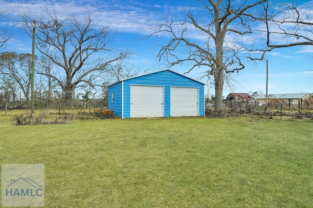 exterior space with a lawn and a garage