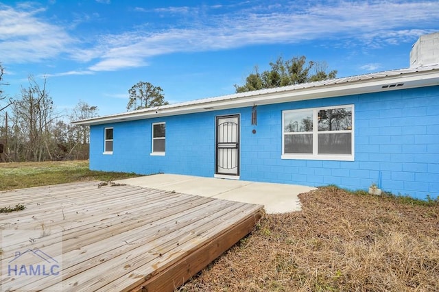 back of property featuring a deck