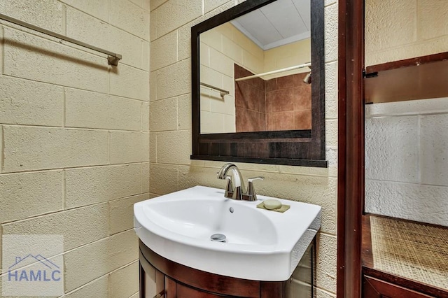 bathroom featuring vanity and crown molding