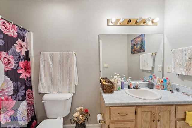 full bath featuring toilet, a shower with curtain, and vanity