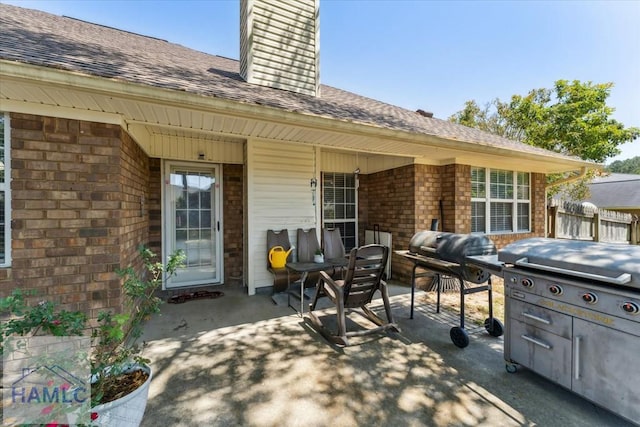 view of patio / terrace featuring fence