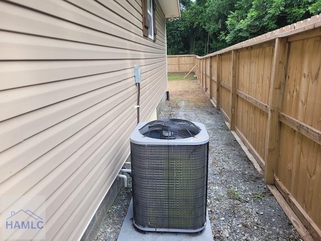 2922 7th St, Columbus, GA 31906 - exterior view of a central AC unit and a fenced backyard