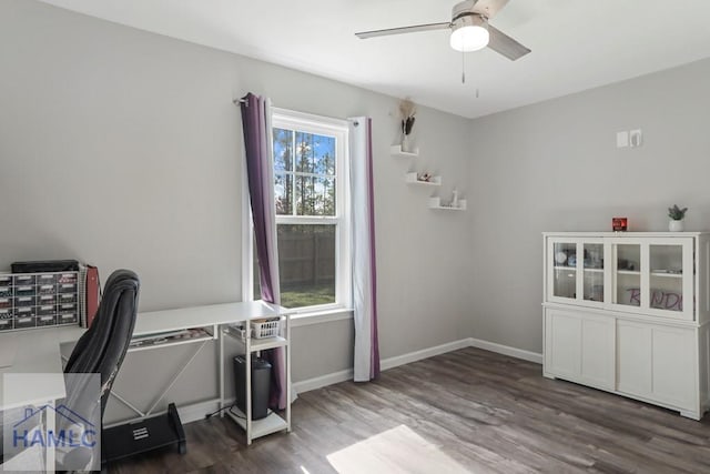 office featuring baseboards, ceiling fan, and wood finished floors