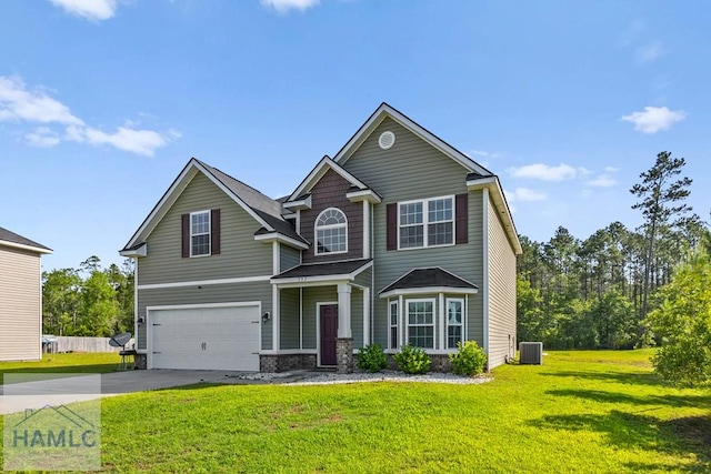 557 Archie Way NE, Ludowici, GA 31316 - view of front of home featuring concrete driveway, an attached garage, a front yard, and cooling unit