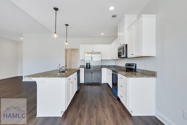 kitchen featuring stainless steel appliances, sink, hanging light fixtures, and white cabinets