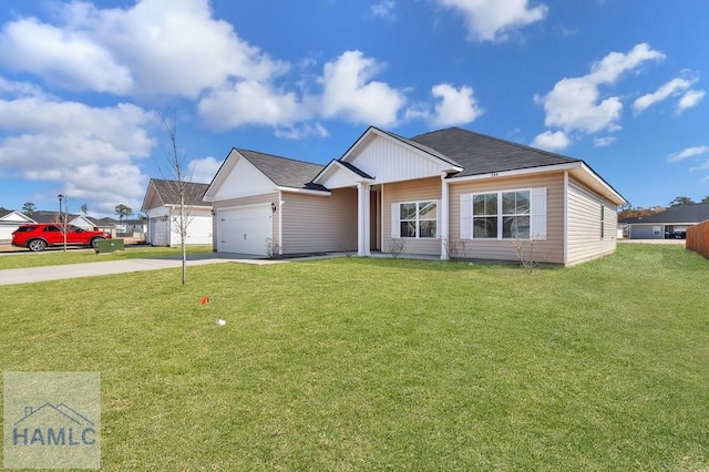 view of front of house featuring a garage and a front lawn