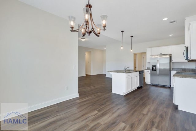 kitchen with hanging light fixtures, a center island with sink, dark hardwood / wood-style floors, stainless steel appliances, and white cabinets