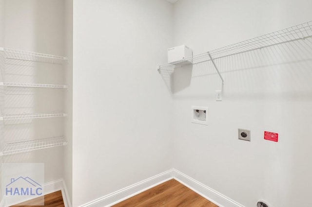 laundry area with hookup for a washing machine, hardwood / wood-style floors, and electric dryer hookup