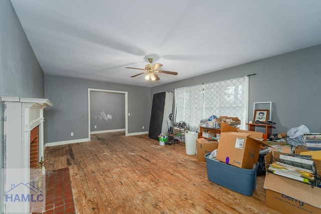 153 Drennon Dr, Jesup, GA 31545 - living area with a ceiling fan, wood-type flooring, baseboards, and a fireplace