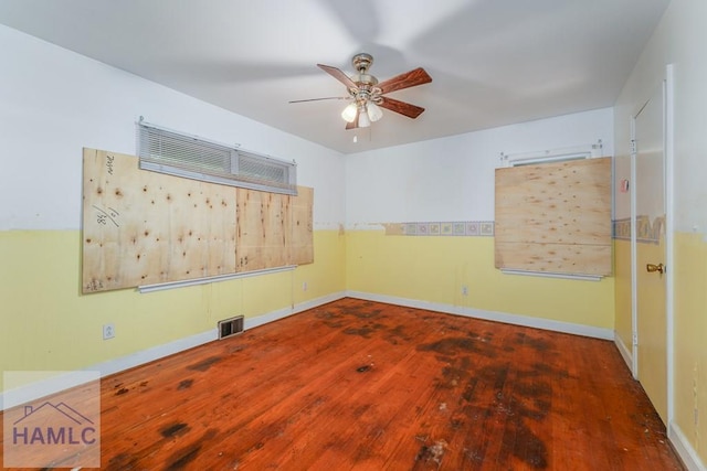 153 Drennon Dr, Jesup, GA 31545 - spare room featuring hardwood / wood-style flooring, a ceiling fan, and baseboards