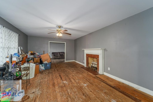 153 Drennon Dr, Jesup, GA 31545 - living area featuring wood-type flooring, ceiling fan, baseboards, and a fireplace
